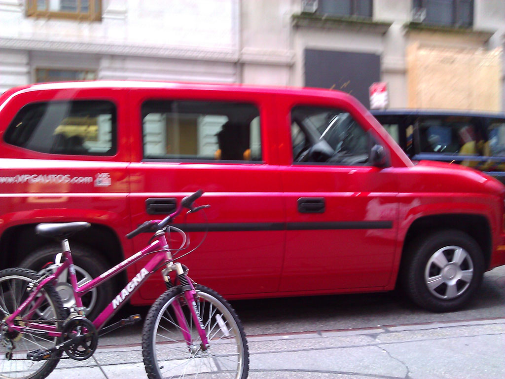 larger photo of a red Nissan MV-1
