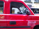 photo of the front a red Nissan MV-1
