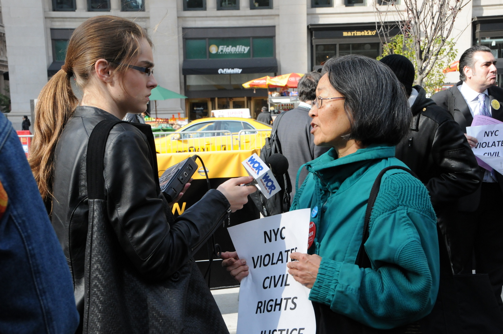 photo of WOR reporter interviewing a demonstrator