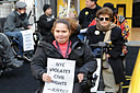 photo of demonstrators in wheelchairs in a line